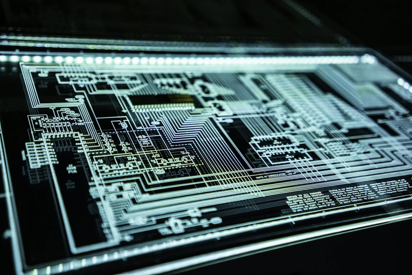 Illuminated circuit board representing cybersecurity engineering