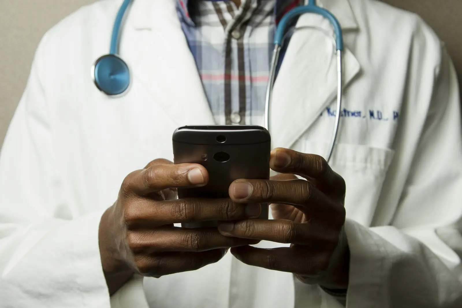 Doctor using a healthcare app on a smartphone