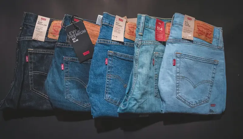 Stack of denim garments ready for inspection